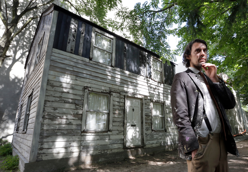 In this Aug. 23, 2017, photo, American artist Ryan Mendoza poses in front of the rebuilt house of Rosa Parks in Berlin. Parks’ house has been standing in the German capital for less than a year, but now Mendoza, who saved it from destruction in Detroit, says it’s time for it to return to the U.S. (Michael Sohn/AP Images)